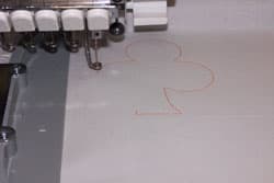 outline the applique design with embroidery machine